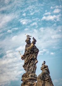 Low angle view of statue against sky