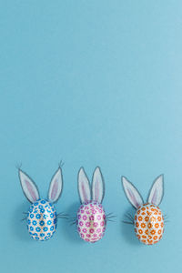 Directly above shot of various fruits on table against blue background