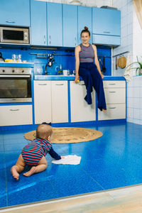 Little girl helps mom in the kitchen. household chores, housekeeping for parents