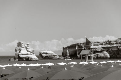 Panoramic view of buildings and sea against sky