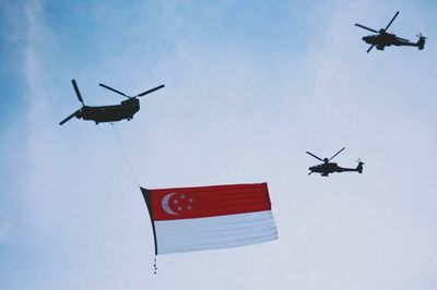 Low angle view of airplane flying in sky