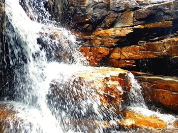 Close-up of water flowing through rocks