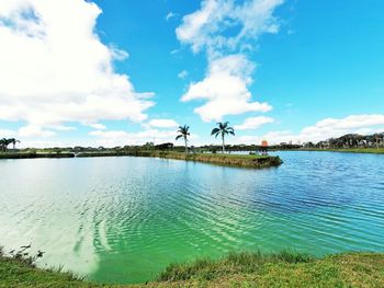 Scenic view of beach against blue sky