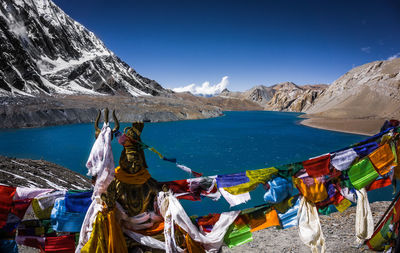 Panoramic view of sea and mountains against blue sky