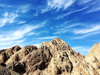 Low angle view of rocks against sky