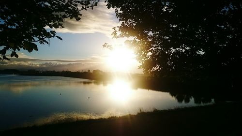 Sun shining over lake