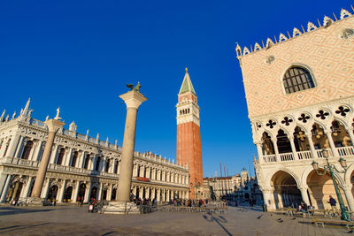 Low angle view of historical building against blue sky