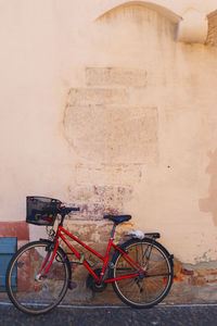 A bicycle parked against an old building in freiburg im breisgau