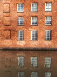 Building reflecting on canal