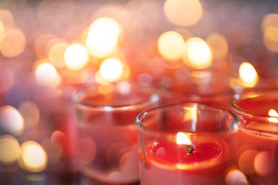 Close-up of illuminated tea light candles