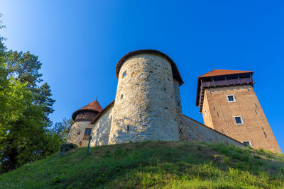 Low angle view of old building against sky