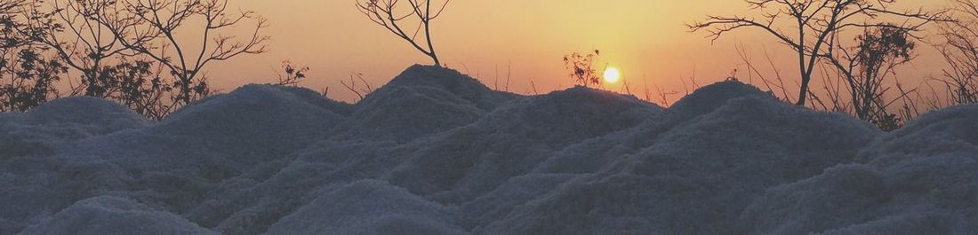 Scenic view of landscape at sunset