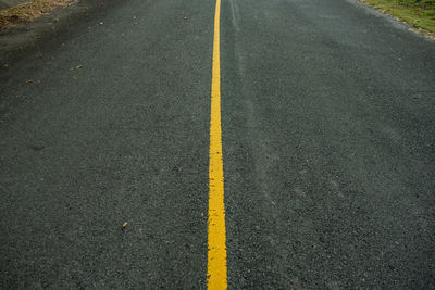 High angle view of yellow lines on road