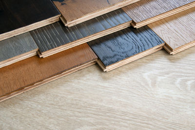 Close-up of piano on hardwood floor at home