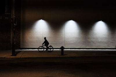 Side view of man cycling