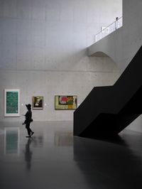 Man walking in corridor of building