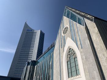 Low angle view of modern buildings against clear sky