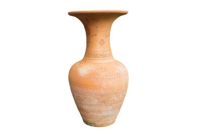 Close-up of vase against white background