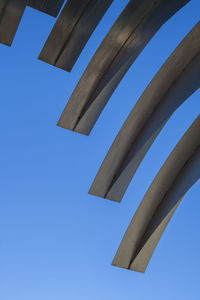 Low angle view of built structure against clear blue sky