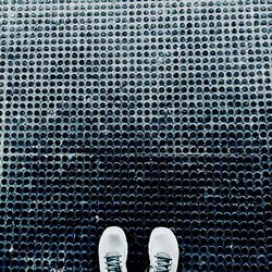 Low section of man on patterned floor