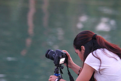 Woman photographing outdoors