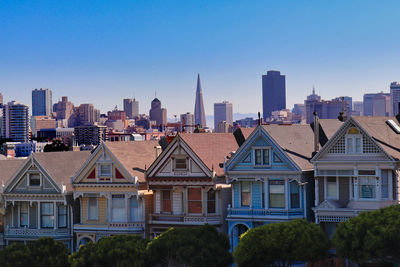 Modern buildings in city against clear blue sky - painted ladies - san francisco