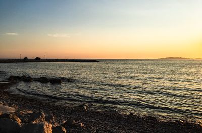Scenic view of sea against sky during sunset