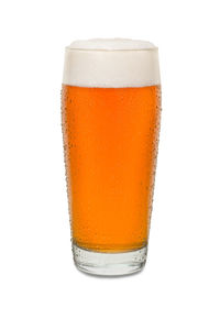 Close-up of beer glass against white background