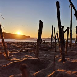 Scenic view of beach against sky during sunset