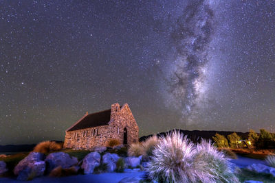 Panoramic view of buildings against sky at night