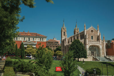 Panoramic view of buildings against blue sky