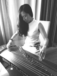 Woman playing zither