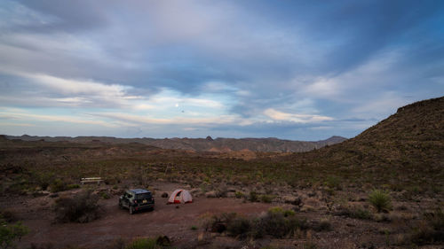 Cars on land against sky
