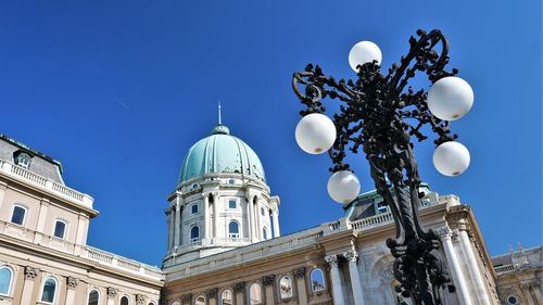 Low angle view of building against blue sky