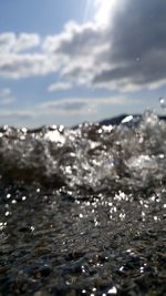 Close-up of frozen sea against sky