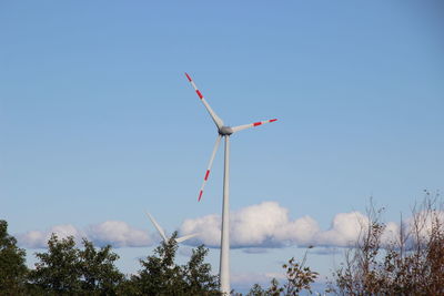 Low angle view of wind turbine against sky