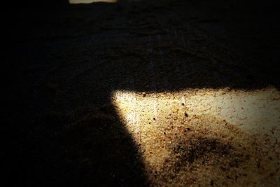 High angle view of shadow on sand