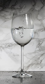 Close-up of wine in glass on table