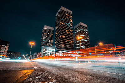 Light trails on city street at night