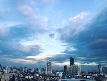 Modern buildings in city against sky