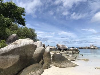 Rocks on shore against sky