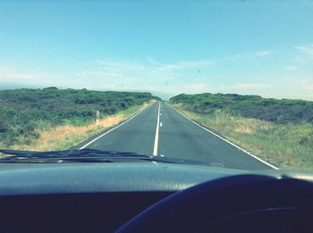 Road seen through car windshield