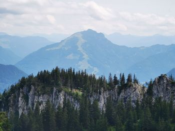 Panoramic view of trees and mountains against sky