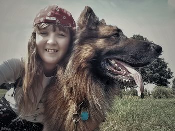 Portrait of young woman with dog