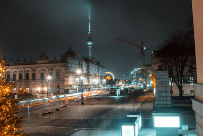 Illuminated buildings in city at night
