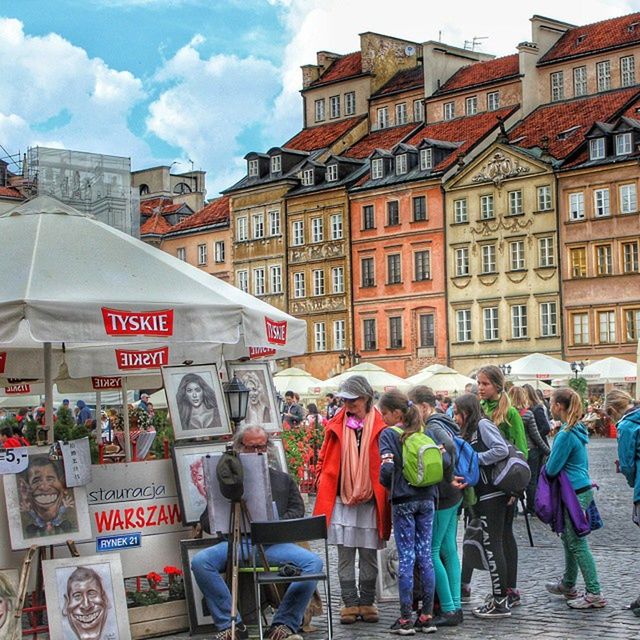 building exterior, architecture, built structure, market, retail, men, market stall, store, street, lifestyles, person, text, for sale, large group of people, city, shopping, selling, casual clothing, city life