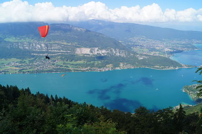 High angle view of people paragliding above river