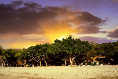 Scenic view of landscape against sky at sunset