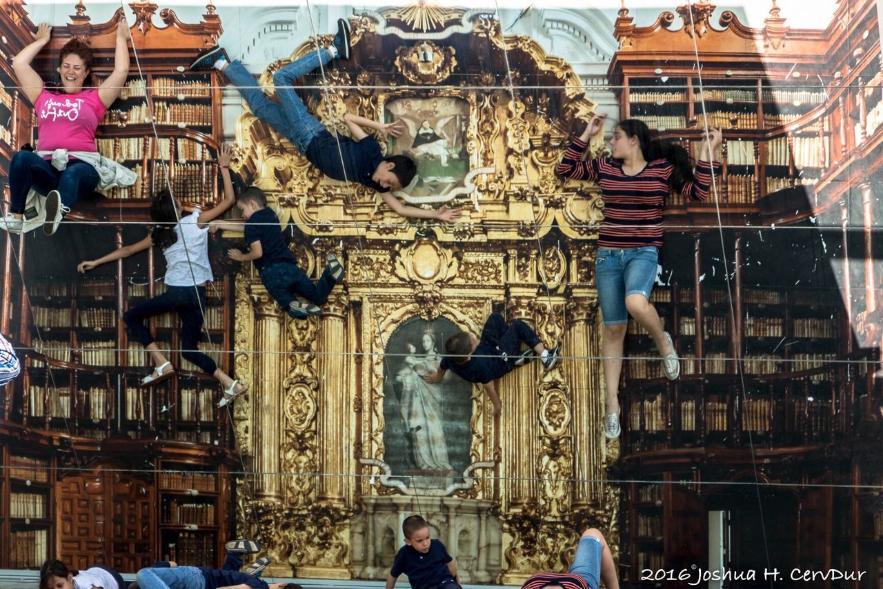 architecture, built structure, building exterior, spirituality, religion, place of worship, person, city, incidental people, facade, city life, outdoors, architectural column, church, history, tourism, day