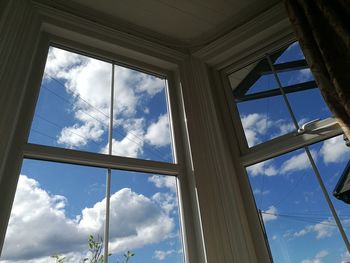 Low angle view of sky seen through window